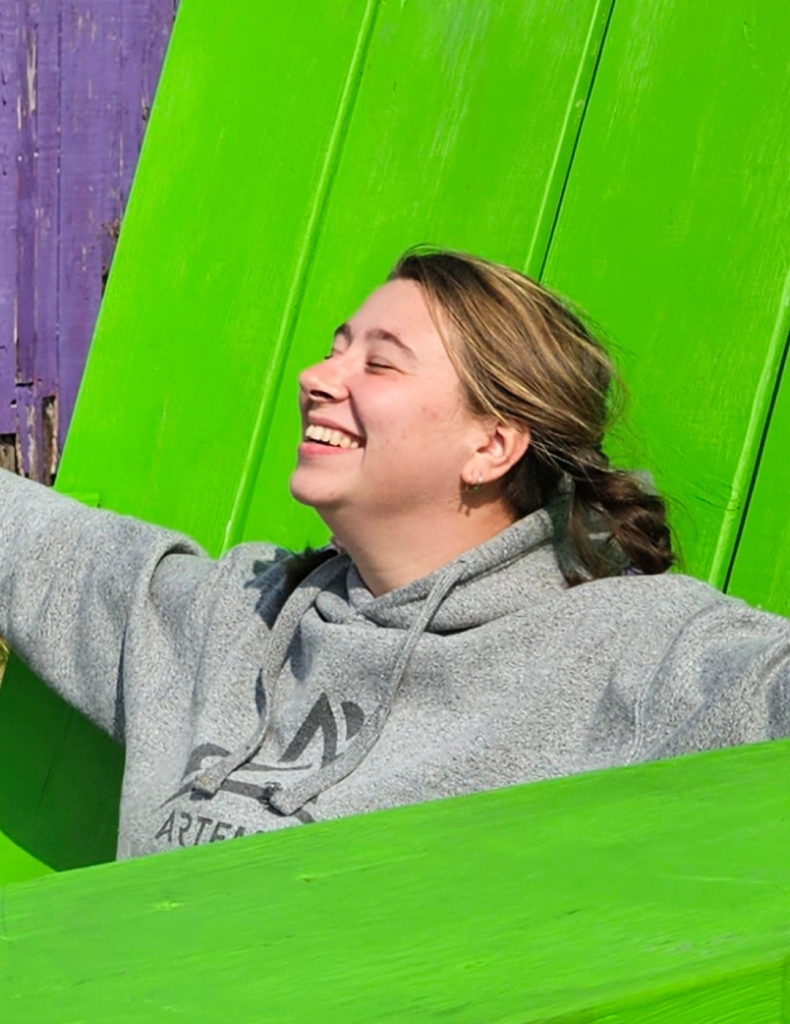 Danielle Thiessen, an employee of Pick Plant and Prune basking in the sun.